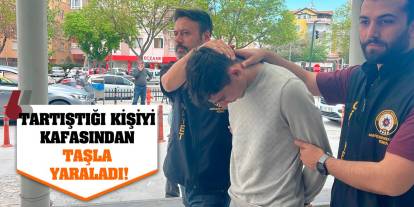 Tartıştığı kişiyi kafasından taşla yaraladı!