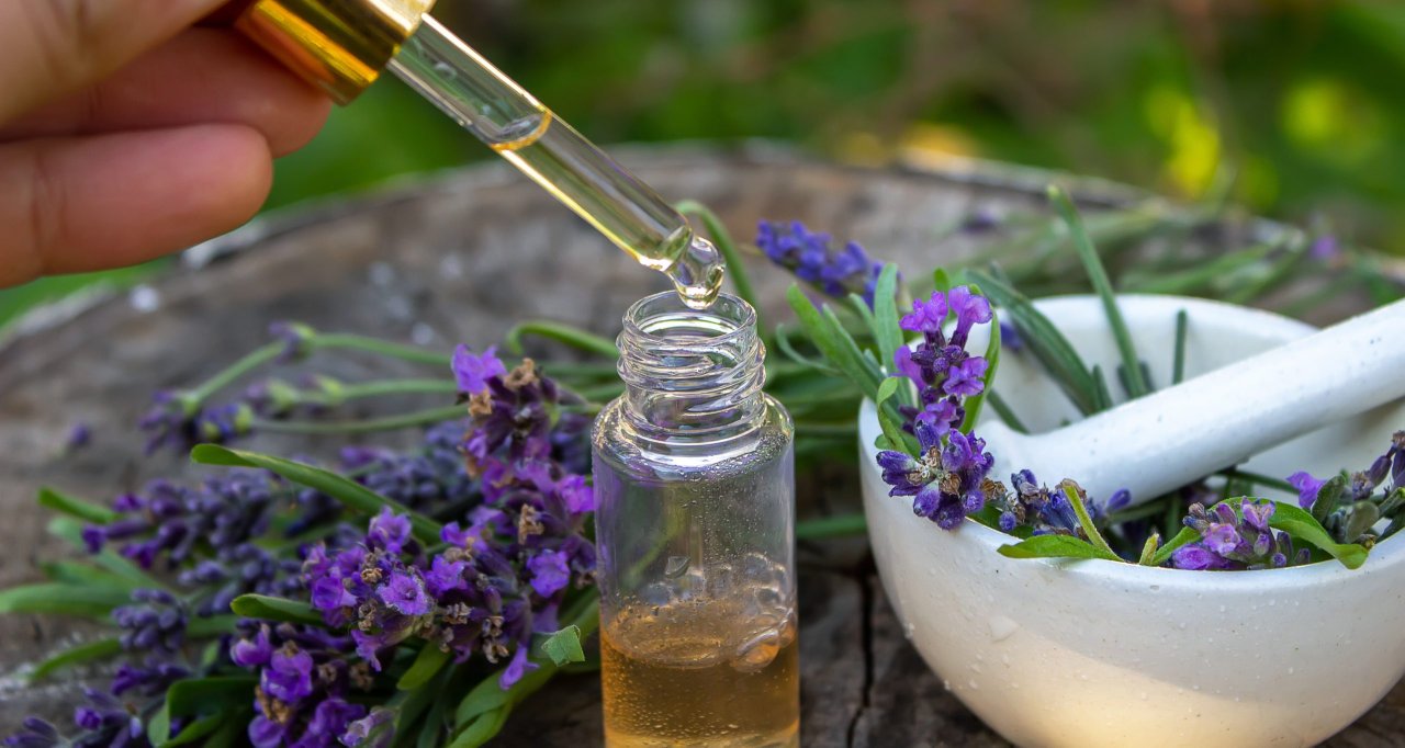 herbal-oil-and-lavender-flowers-on-a-wooden-backgr-2023-11-27-04-55-11-utc-scaled.jpg